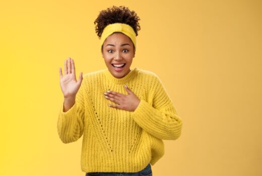 Girl in yellow background greeting