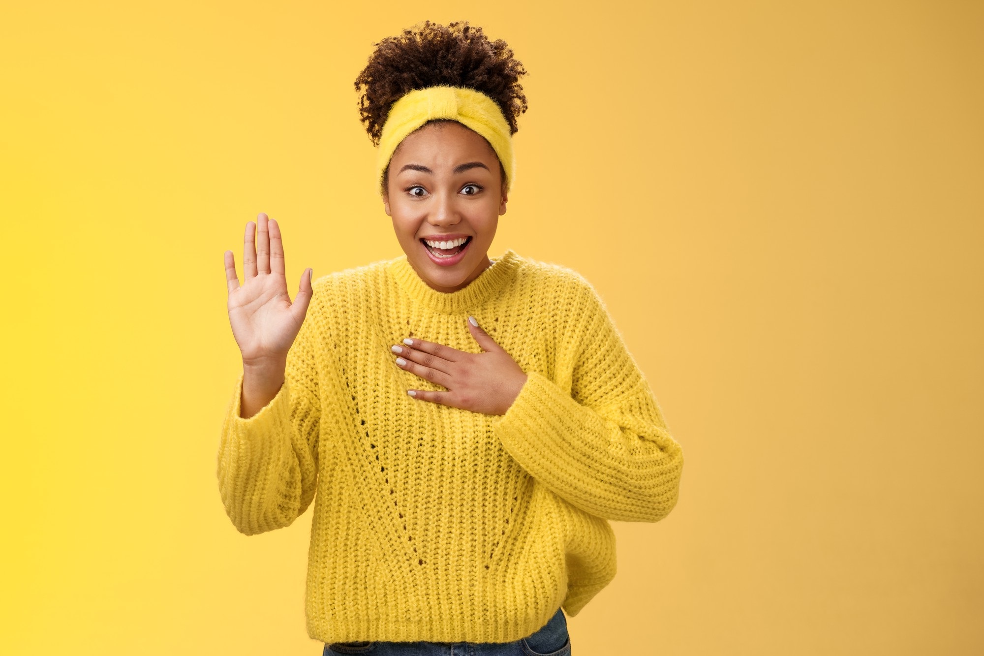 Girl in yellow background greeting